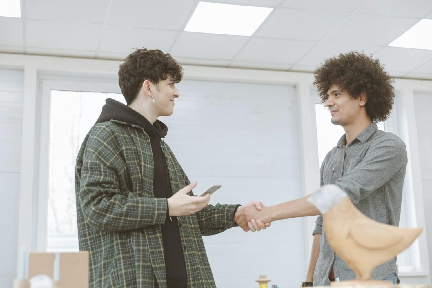Students reviewing real estate documents and market analysis charts during learning session